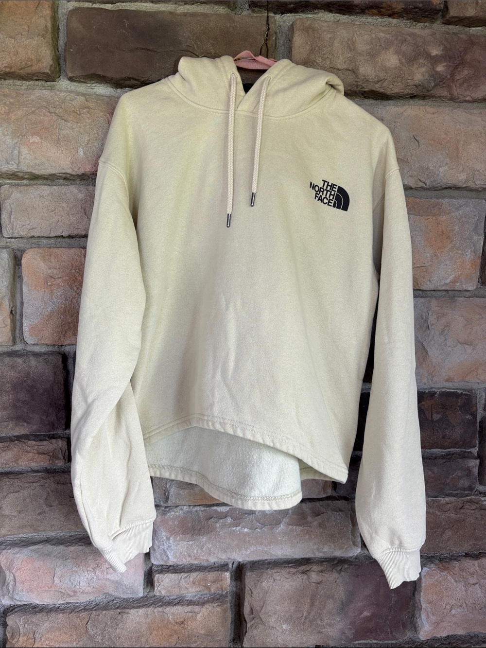 The North Face Cream Hooded Sweatshirt with Black Logo